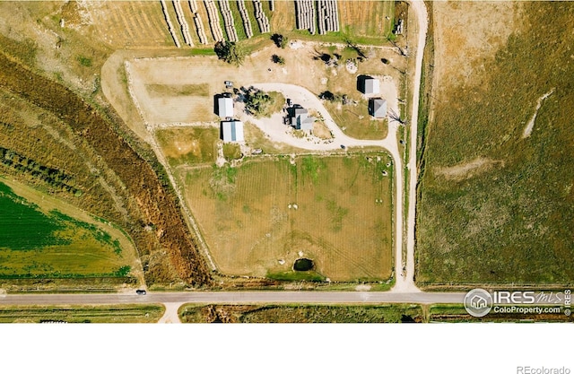 birds eye view of property featuring a rural view