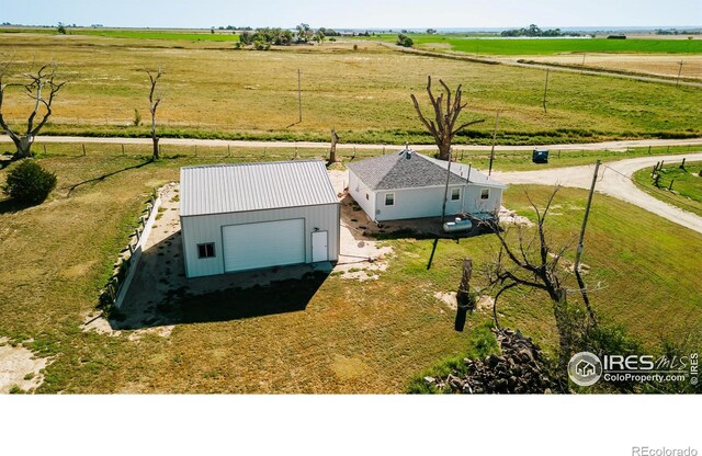 birds eye view of property with a rural view