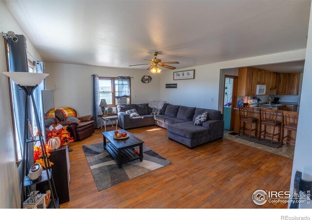 17327 County Road 46, Sterling, CO 80751 - living room featuring wood finished floors and ceiling fan