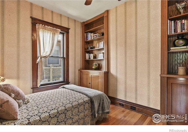 bedroom featuring ceiling fan and hardwood / wood-style floors