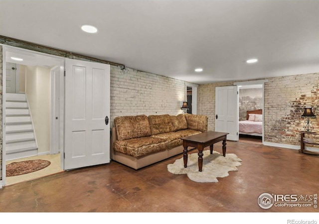 living room featuring brick wall