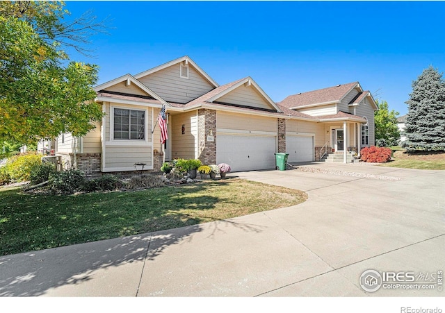 view of front of house featuring a garage and a front yard