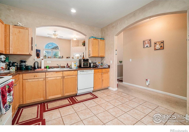 kitchen with white appliances, ceiling fan, sink, and light carpet