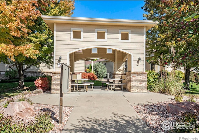 surrounding community with a patio area