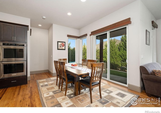 dining area with light hardwood / wood-style floors