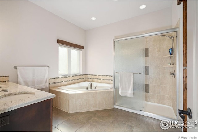 bathroom with tile patterned floors, vanity, and plus walk in shower