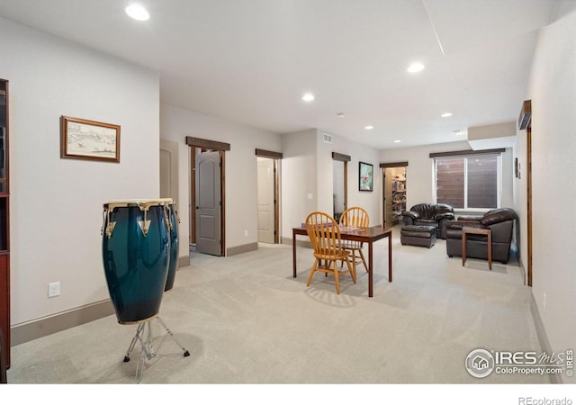 dining space featuring light colored carpet