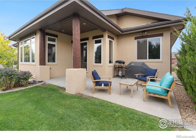 back of house with a yard and a patio area