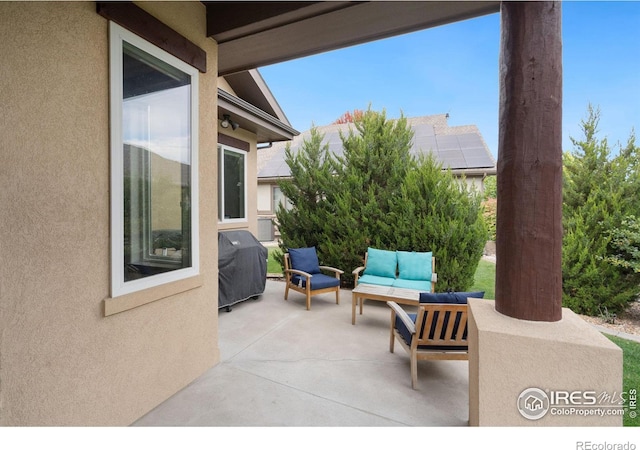 view of patio featuring a grill and an outdoor living space