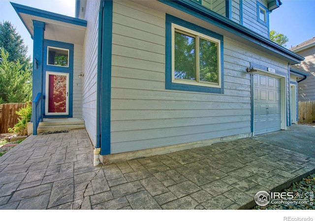 view of property exterior featuring a garage