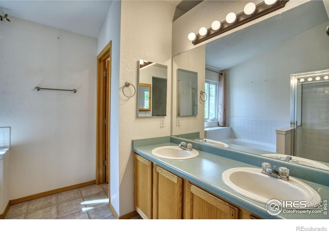 bathroom with vaulted ceiling, tile patterned flooring, separate shower and tub, and vanity