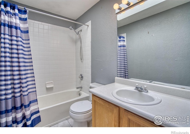 full bathroom with tile patterned flooring, shower / bathtub combination with curtain, vanity, and toilet