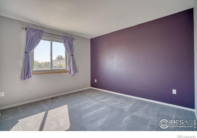 unfurnished room featuring carpet floors