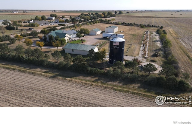 birds eye view of property with a rural view