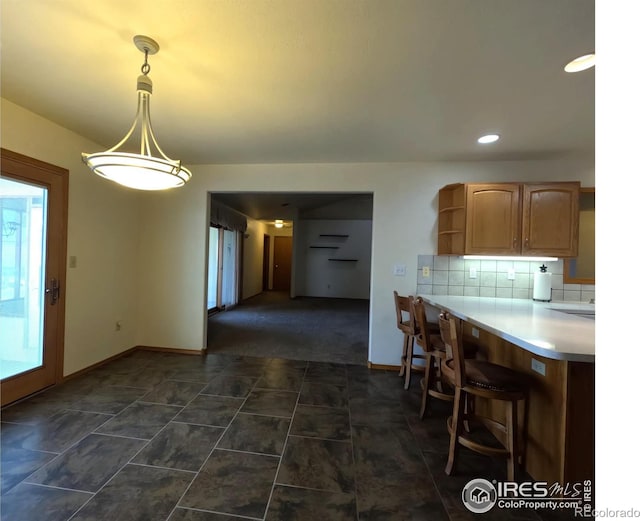 dining space featuring recessed lighting and baseboards