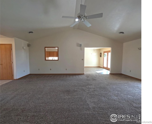 carpeted empty room featuring lofted ceiling, a ceiling fan, visible vents, and baseboards