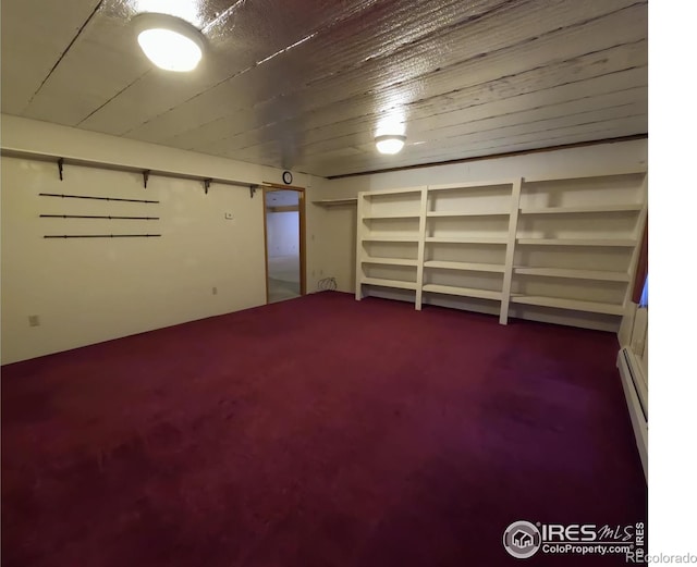 finished basement featuring wooden ceiling