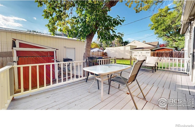 wooden deck with an outdoor structure