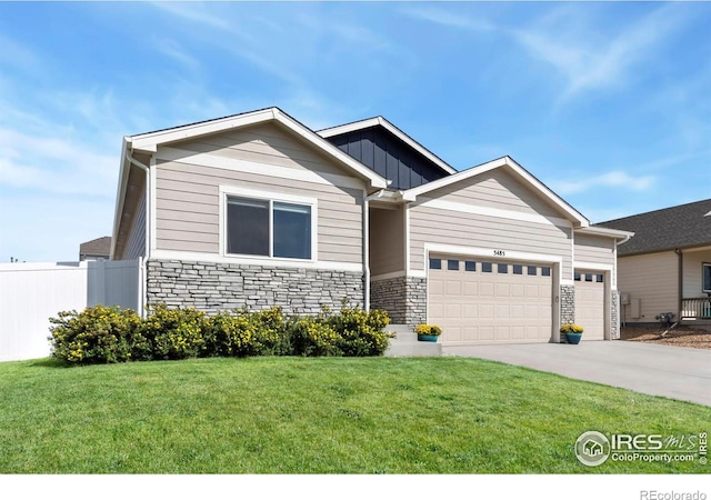 craftsman-style home with a front yard and a garage