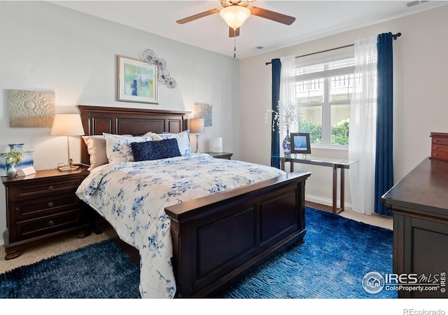 carpeted bedroom featuring ceiling fan