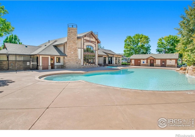 view of swimming pool with a patio area