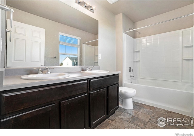 full bathroom featuring  shower combination, vanity, and toilet