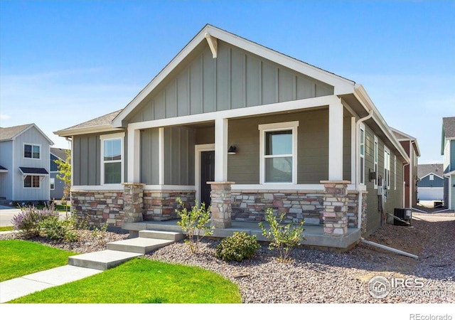 craftsman-style home featuring a porch and central AC unit