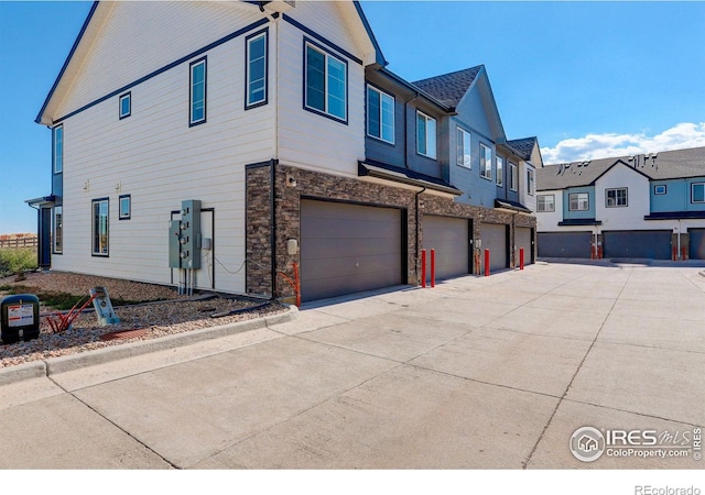 view of side of home featuring a garage