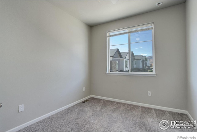 spare room featuring carpet flooring