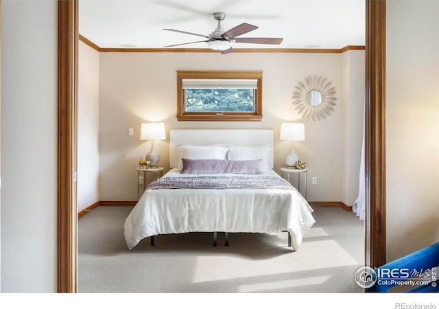 bedroom featuring carpet, crown molding, and ceiling fan