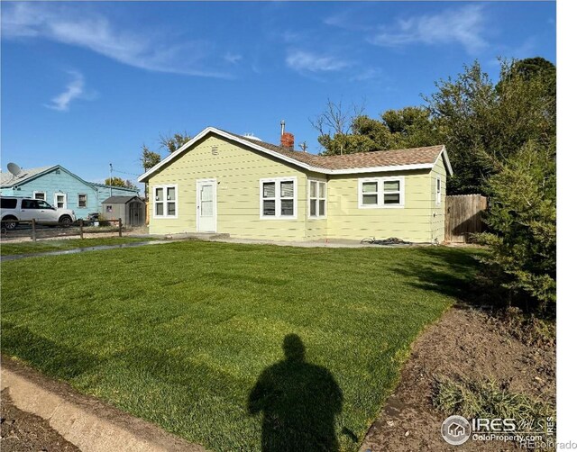 130 W 4th St N, Cheyenne Wells, CO 80810 - view of front of home with a front lawn