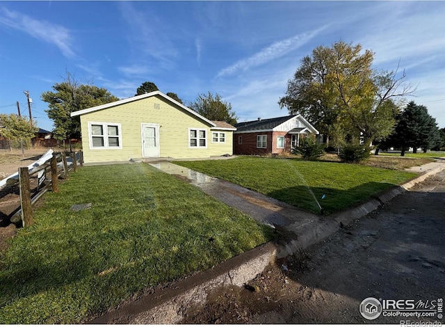 ranch-style house with a front yard