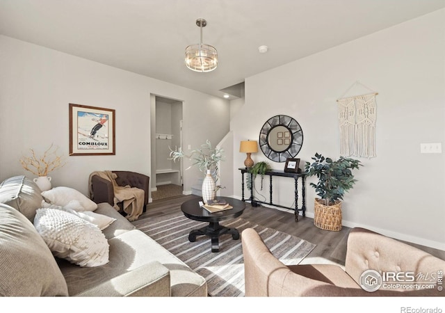 living room with a chandelier and hardwood / wood-style floors