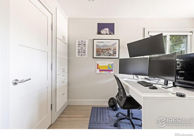 office space with light hardwood / wood-style flooring