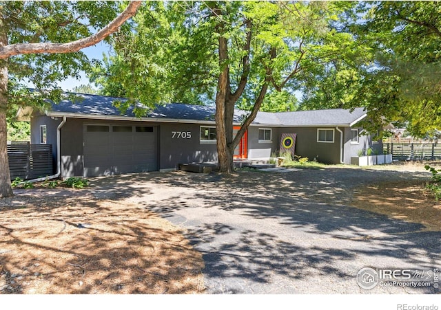 single story home with a garage