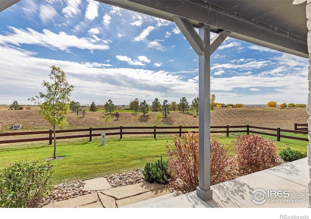 view of yard with a rural view