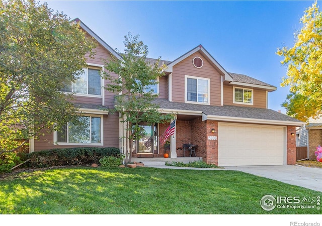 view of front of home featuring a garage and a front lawn