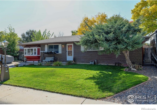 single story home featuring a front yard