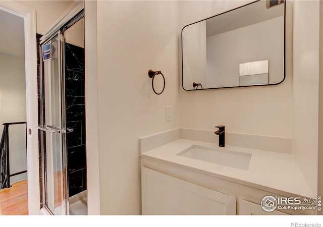 bathroom featuring vanity and hardwood / wood-style floors