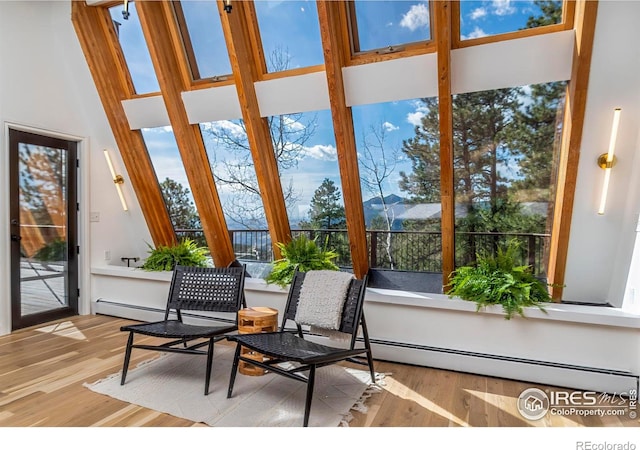 sunroom / solarium with baseboard heating and a healthy amount of sunlight