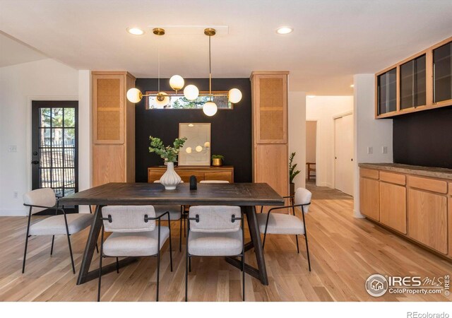 dining area with light hardwood / wood-style flooring