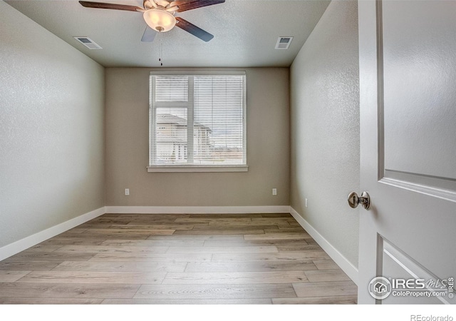 unfurnished room featuring light hardwood / wood-style flooring and ceiling fan