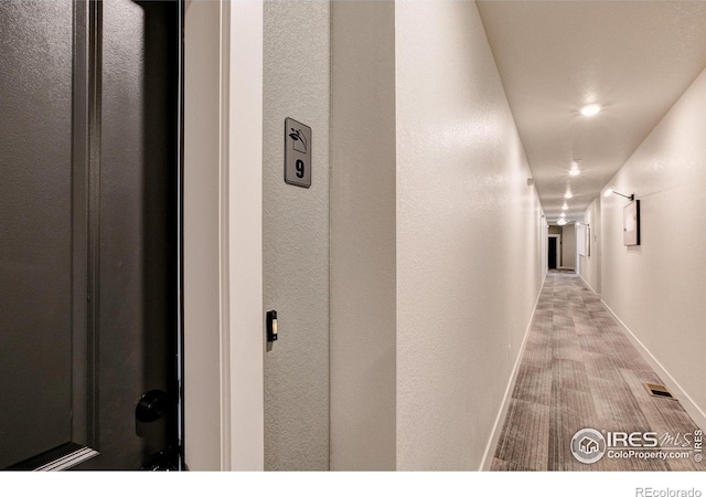 hallway featuring light hardwood / wood-style floors