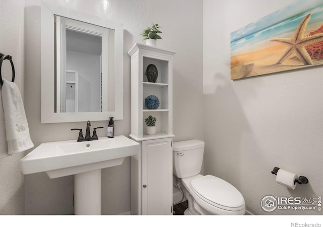 bathroom featuring toilet