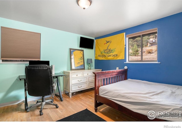 bedroom featuring light wood-type flooring