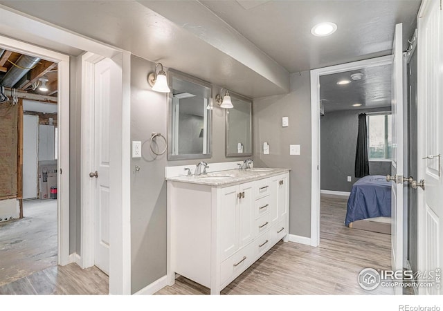 bathroom featuring hardwood / wood-style flooring and vanity