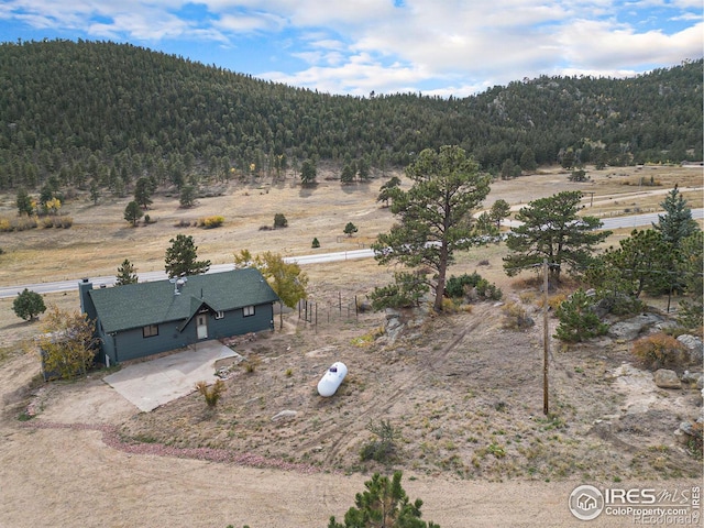 birds eye view of property with a rural view