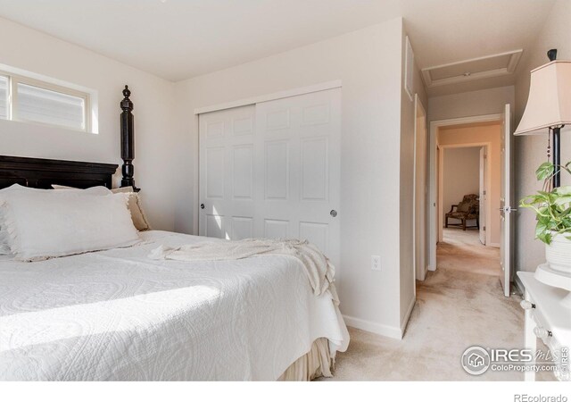 carpeted bedroom with a closet