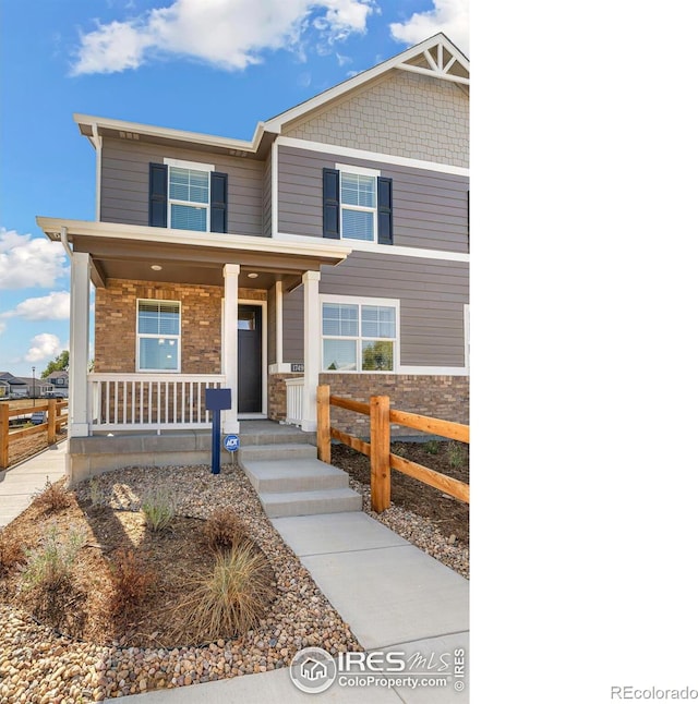 1731 Floating Leaf Dr Unit A, Fort Collins, CO 80528 - craftsman-style house with a porch and fence