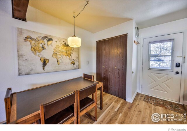 dining space with light hardwood / wood-style flooring